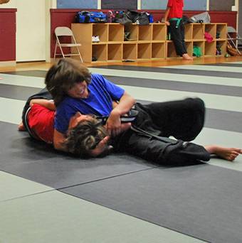 Instructor demonstrating technique to new student